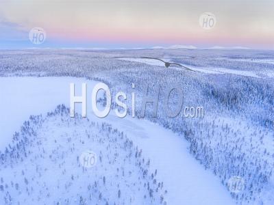 Aerial Drone Photo Of Snow Covered Lake And Forest Winter Landscape Showing Amazing Lapland Scenery In Scandinavia In Finland