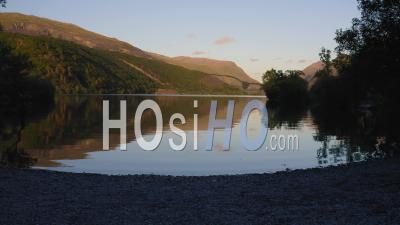 Peaceful Little Bay On Llyn Padarn Lake During Sunset, Beautiful Reflection On Water Surface, Snowdonia National Park In Wales - Video Drone Footage