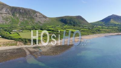 Bright Blue Sea Sea With Lush Field And Rough Coast In Llyn Peninsula, Wales, Uk - Wide Shot - Video Drone Footage