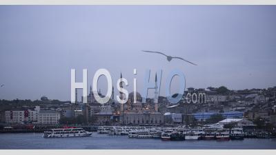 Day To Night Timelapse In Istanbul, Turkey. Time Lapse Of New Mosque (yeni Cami) On The Banks Of The Golden Horn And Bosphorus River At Night With Hagia Sophia (aya Sofya) Behind
