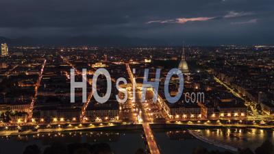 Establishing Aerial View Shot Of Turin It, Mole Antonelliana On The Horizon, Torino Skyline, Italy At Night Evening - Video Drone Footage