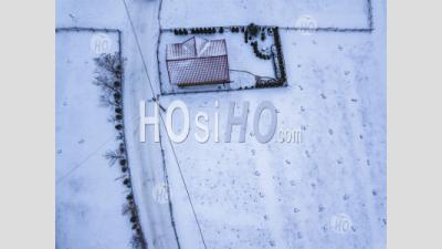 Snowy Covered House In The Carpathian Mountains, Bran, Transylvania, Romania - Aerial Photography