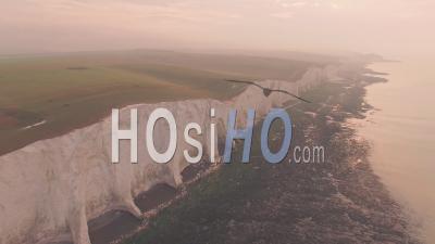 Seven Sisters Cliffs, An Iconic British Landscape At Sunset In South Downs National Park, England. High Aerial Drone View
