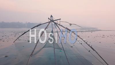 Traditional Chinese Fishing Nets At Sunrise, Fort Kochi In India. Aerial Drone View