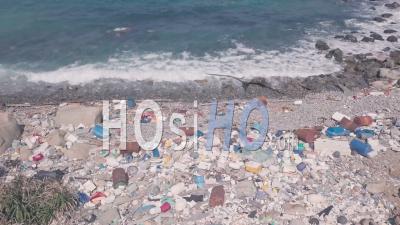 Climate Change Environmental Impact Of Beach Covered In Plastic And Rubbish In Hong Kong. Aerial Drone View