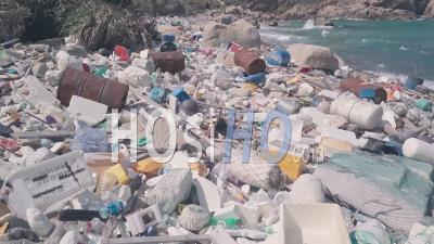 Environmental Destruction Caused By Beach Covered In Plastic And Rubbish Causing Climate Change In Hong Kong. Aerial Drone View