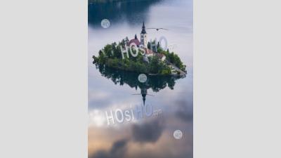 Slovenia Landscape. Lake Bled Island Reflections And The Church Of The Assumption Of St Mary At Sunrise, Slovenia, Europe