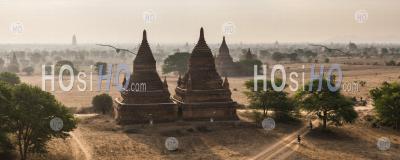 Tourists Exploring The Temples Of Bagan (pagan) At Sunrise, Myanmar (burma)