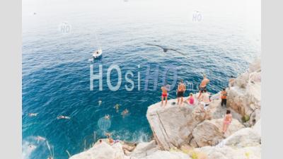 Tourists Swimming At Buza Bar, Aka Cafe Buza, Dubrovnik, Croatia