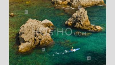 Sea Kayaking In Dubrovnik, A Tourist Kayaking In The Mediterranean Sea, Croatia