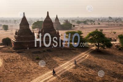 Tourists Exploring The Temples Of Bagan (pagan) At Sunrise, Myanmar (burma)