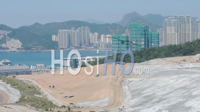 Climate Change Emergency. Landfill Tip Destroys Environment On Coast In Hongkong - Aerial Drone Shot