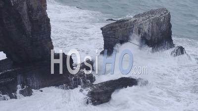 Rough Waves Crashing On Elegug Stacks, Pembrokeshire Coast National Park, Wales, On A Moody Day