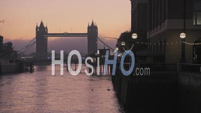 Tower Bridge And Hms Belfast In London With Beautiful Colourful Sunrise And Orange Sky, Showing Iconic Skyline On Day One Of Coronavirus Covid-19 Lockdown In England, Uk