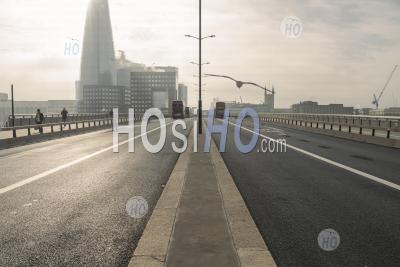 Quiet, Empty And Deserted Roads And Streets In London In Coronavirus Covid-19 Pandemic Lockdown At The Shard At London Bridge, With No Traffic Commuting During Rush Hour Commute