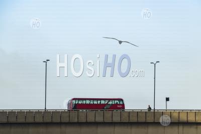 London Background With Copy Space, With Streets Quiet During Coronavirus Covid-19 Lockdown In England, Showing Red London Bus And One Person On London Bridge, England, Uk, Europe