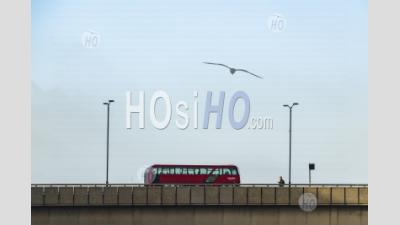 London Background With Copy Space, With Streets Quiet During Coronavirus Covid-19 Lockdown In England, Showing Red London Bus And One Person On London Bridge, England, Uk, Europe