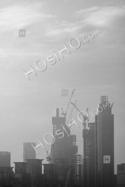 Construction Background With Copy Space In Black And White, London Cityscape Background With Tall Skyscrapers And Office Blocks And Misty City Buildings, England, Uk, Europe