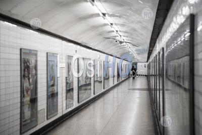 Quiet, Empty London Underground Tube Station In Coronavirus Covid-19 Pandemic Lockdown, With One Lone Person On Public Transport When Trains Were Reduced During Travel Ban
