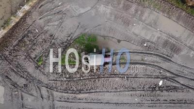 Aerial Look Down Tractor Plow Cultivate The Soil - Video Drone Footage