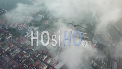 Aerial View Morning Fog Surrounds George Town World - Video Drone Footage