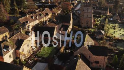 Aerial Drone Video Of A Cotswolds Village Church, A Rural Scene In English Countryside With Houses, Property And Real Estate In The United Kingdom Housing Market, Bourton On The Hill, Gloucestershire, England