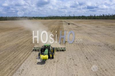 Farmer Prepares Field For Planting Peanuts - Aerial Photography