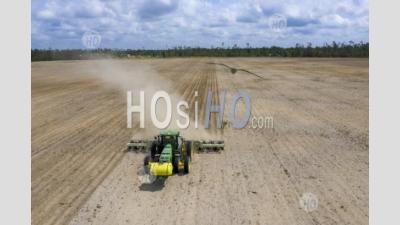 Farmer Prepares Field For Planting Peanuts - Aerial Photography