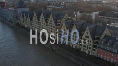Aerial View Of  European Houses On River In Cologne Germany With Beautiful Sunlight 4k - Video Drone Footage
