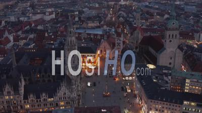 Beautiful Marienplatz Famous City Square In Center Of Munich, Germany After Sunset With Scenic City Lights And New Town Hall, Aerial Wide Angle View - Video Drone Footage