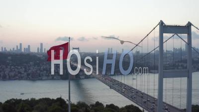 Dolly Forward Past Waving Turkish Flag Revealing Bosphorus Bridge, Aerial Wide Shot Dolly Forward - Video Drone Footage