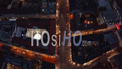Flight Over Typical Neighborhood In Munich, Germany Beautiful Winter Vibe At Night With City Lights And Traffic Glowing, Aerial Birds Eye Overhead Top Down View - Video Drone Footage