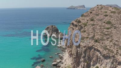 Slow Aerial Flight Above Greek Island Milos Turquoise Blue Ocean With Rocky Cliff Coast 4k - Video Drone Footage