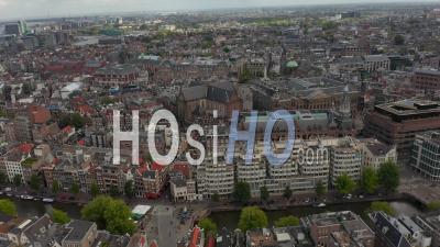 Slow Forward Aerial Of Amsterdam Cityscape And Royal Palace On Cloudy Day 4k - Video Drone Footage