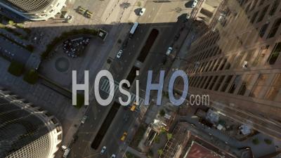 Epic Lowering And Circling Overhead Birds Eye View Over Downtown Los Angeles California In Beautiful Sunset Light With View Of Skyscraper Rooftops And Car Traffic Passing 4k - Video Drone Footage