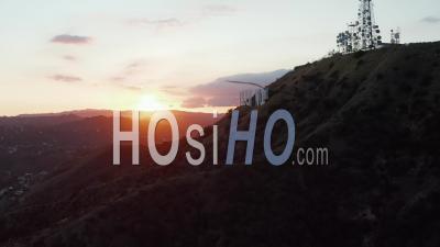 Hollywood Hills In Beautiful Sunset Golden Hour Light And View On Hollywood Sign On Mountain Side In Los Angeles, California 4k - Video Drone Footage