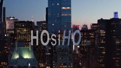 Close Up Of Essex House Manhattan Skyline At Night With Flashing City Lights In New York City At Central Park In Beautiful 4k - Video Drone Footage