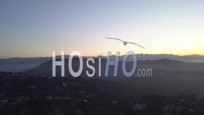 Over Hollywood Hills At Sunrise With View On Hollywood Sign In Los Angeles View 4k - Video Drone Footage