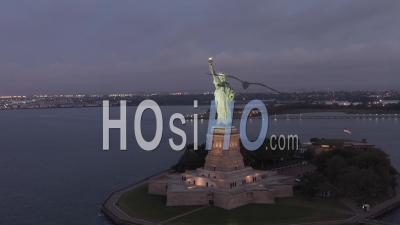 Circling Statue Of Liberty Beautifully Illuminated In Early Morning Light 4k New York City - Video Drone Footage