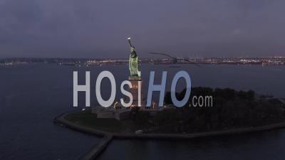 Circling Statue Of Liberty Beautifully Illuminated In Early Morning Light 4k New York City - Video Drone Footage