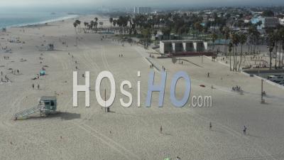 Circling Around Venice Beach Skatepark And Boardwalk With Palm Trees And Bike Lane Sunny, Los Angeles California 4k - Video Drone Footage