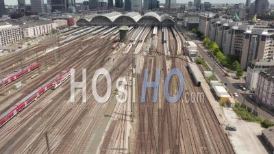 Aerial View Forward Flight Over Frankfurt Am Main, Germany Central Train Station Train Tracks On Beautiful Summer Day With Little Traffic Due To Coronavirus Covid 19 Pandemic - Video Drone Footage