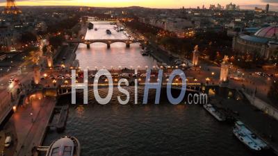 Aerail View By Drone At Sunset Of Eiffel Tower On Seine River Bridge Paris City Lights Reveal Shot During Autumn 