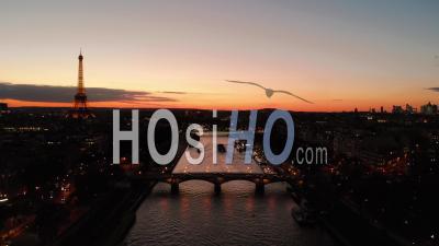 Aerail View By Drone At Sunset Of Eiffel Tower On Seine River Bridge Paris City Lights Reveal Shot During Autumn