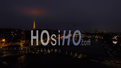Aerail View By Drone At Sunset Of Eiffel Tower On Seine River Bridge Paris City Lights Reveal Shot During Autumn 