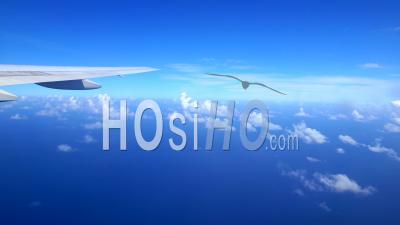  Airliner Window View Of Moving Clouds