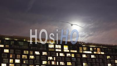 Time-Lapse Of The Exterior Of A Modern Apartment Block At Night