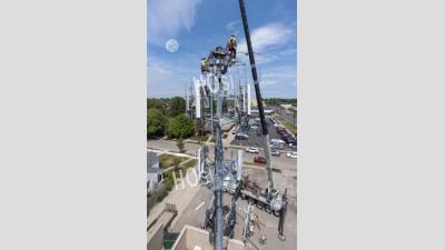 Workers Upgrade Cell Tower - Aerial Photography