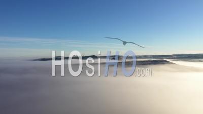 Aerial View Of Hills In Mystic Foggy, Cold Winter Morning By Drone