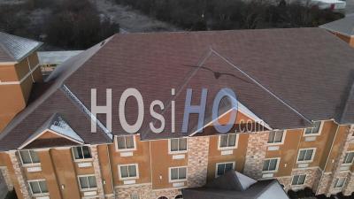 Motel At Sunrise With Snow On Roof - Video Drone Footage